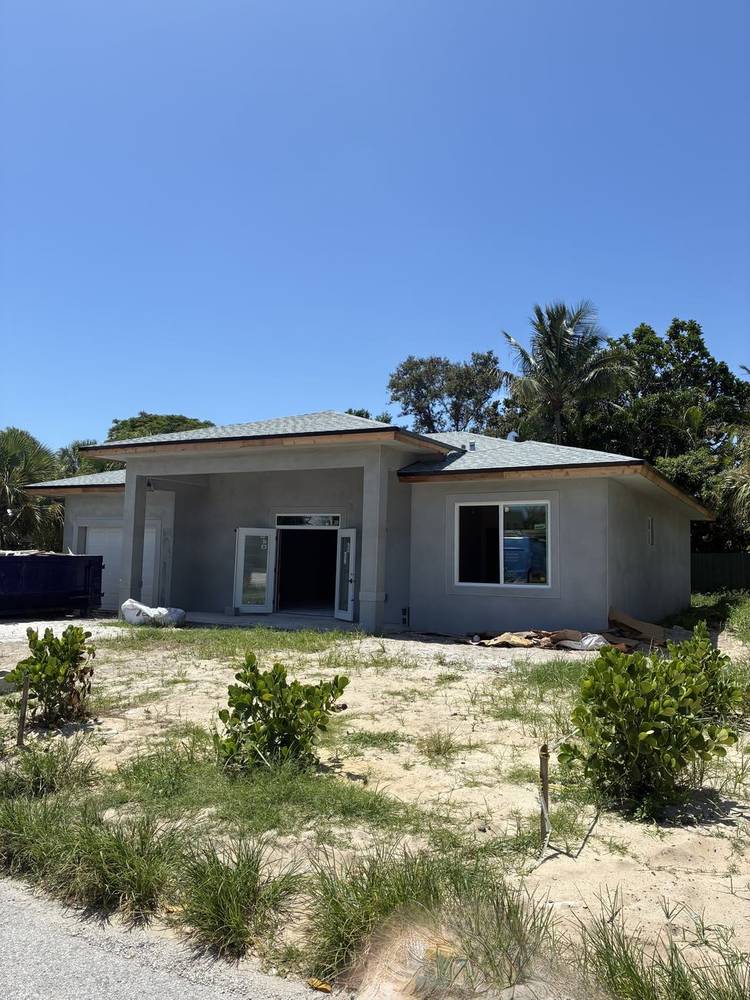 Before — bare stucco finish, Front Elevation, Prosperity Farms