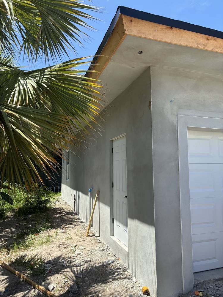Before — bare stucco finish, Garage Elevation, Prosperity Farms