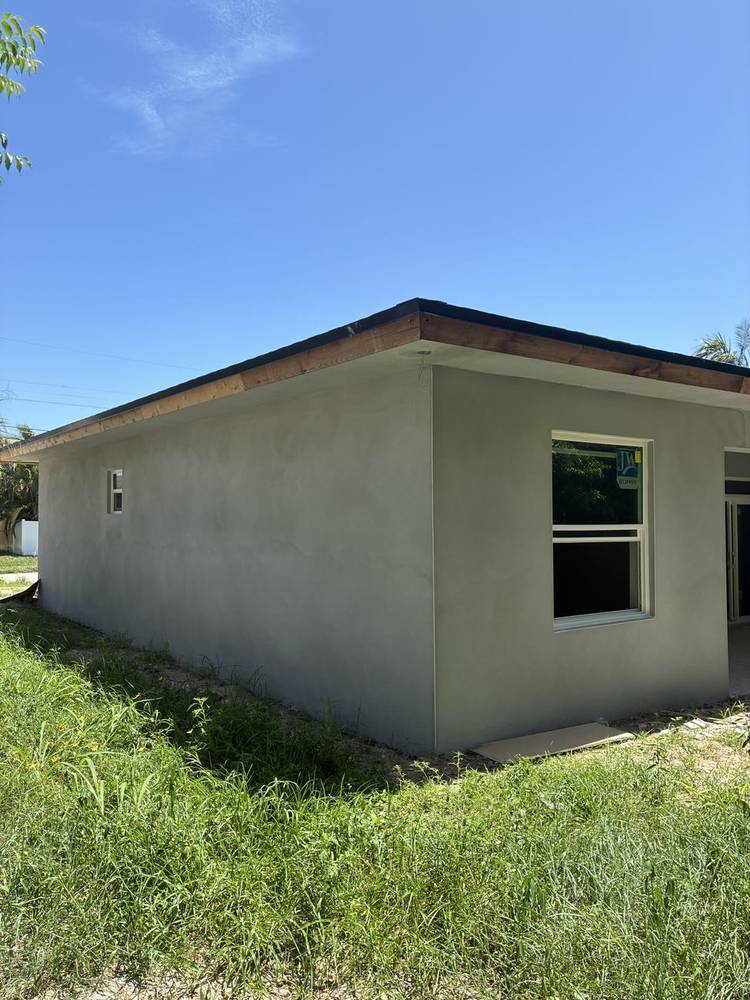Before — bare stucco finish, Rear Corner Elevation, Prosperity Farms